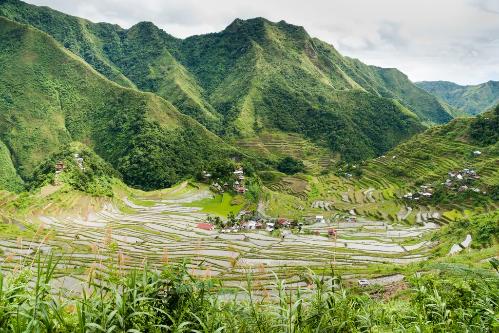 The Batad rice terraces curving around a mountain valley in Banaue, Ifugao